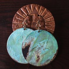 An edgy play on boho style. Verdi gris teal-green patina emphasized by varying darkened layers creating a beautiful moon-like appearance. Please note patina will be different between pieces. Pieces are sealed to prevent tarnish or rub off.  Item will ship on hand stamped leather earring card in a kraft gift box. Edgy Boho, Blush Earrings, Mint Earrings, Patina Earrings, Edgy Earrings, Stamped Leather, Leather Earring, Green Patina, Earring Card