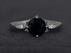 black spinel ring round cut black ring gemstone rings sterling silver party ring Elegant Black Sapphire Ring With Accent Stones, Elegant Black Sapphire Ring With Center Stone, Black Diamonds Round Promise Ring, Black Round Sapphire Ring For Anniversary, Fine Jewelry Black Sapphire Round Ring, Black Sapphire Round Ring In Fine Jewelry Style, Black Sapphire Round Cut Ring Gift, Black Sapphire Ring Gift, Black Sapphire Ring Round Cut Gift