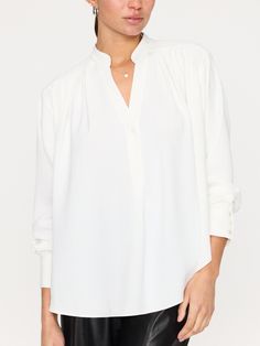 Spring V-neck Blouse With Button Cuffs, Elegant V-neck Top With Button Cuffs, Classic V-neck Relaxed Fit Blouse, Classic V-neck Blouse With Relaxed Fit, Versatile Long Sleeve V-neck Top For Work, Elegant V-neck Top With Cuffed Sleeves, Classic V-neck Blouse For Daywear, Elegant White V-neck Top For Work, Relaxed Fit V-neck Blouse With Buttons