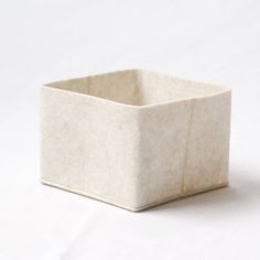 a white square container sitting on top of a table