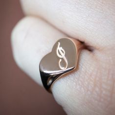 The heart signet ring is a classic, and this one is personalized with an inset monogram. This item is engravable with text or monogram of your choice at no extra cost. The initals are engraved onto the ring and embedded in the 3D model for a flawless embossed finish. You may choose to customize this ring with different images, letters or words. A render of your custom design will be sent to you before production. Heart width: 12mm Heart height: 10mm A few notes about our gold: - Though we do not Engraved Rose Gold Sterling Silver Signet Ring, Engraved Rose Gold Initial Ring In Fine Jewelry Style, Engraved Initial Ring In Rose Gold, Rose Gold Initial Ring With Polished Finish For Anniversary, Engraved Rose Gold Initial Ring, Personalized Classic Heart Promise Ring, Classic Personalized Rose Gold Initial Ring, Rose Gold Signet Ring With Engraving For Anniversary, Rose Gold Signet Ring With Engraving Option For Wedding