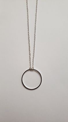 "Sometimes you need just a little something to give that extra spark to your outfit. This is it. This simple yet elegant necklace will soon be a favorite. It features your choice of a repurposed silver circle charm that is just shy of 1\" in diameter or a repurposed bronze silver circle charm that is 3/4\" in diameter. Both dangle from a 16\" chain with a 2\" extender. It's a minimalist's dream as it will wear well with all outfits. Your choice of color - silver-tone or antique bronze. Welcome to Recycled Finery!  I repurpose old jewelry, coins, beads, vintage buttons, watch parts, and charms into new jewelry.  My ever-growing collection of these materials comes from estate sales, rummage sales, antique and thrift stores, and family and friends' collections they no longer need or want. I h Minimalist Round Charm Necklace For Bridesmaid, Simple Everyday Circular Necklace, Simple Everyday Circle Necklaces, Minimalist Open Circle Charm Necklace With Adjustable Chain, Round Charm Necklaces For Bridesmaid Gift, Sterling Silver Circle Charm Necklace With Delicate Chain, Minimalist Full Circle Jewelry For Gifts, Minimalist Full Circle Necklace With Delicate Chain, Silver Circle Necklace With Delicate Chain