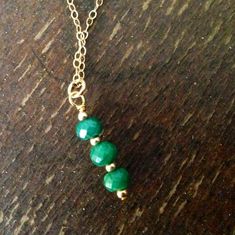 This necklace created by Jewelry by Carmal is made of green emerald faceted gemstones, gold filled: chain, spring ring clasp and findings. This necklace measures 18 inches in length the pendant measures an additional 1/2 inch. View other chain necklaces: http://www.etsy.com/shop/jewelrybycarmal?section_id=8001511 All of our jewelry arrives wrapped and ready for gift giving. We offer free standard shipping, via USPS, within the United States. Green Jewellery, Jewellery Gold, Green Jewelry, May Birthstone, Emerald Necklace, Handmade Wire Jewelry, Jewelry Gemstone, Green Emerald, Chain Pendant