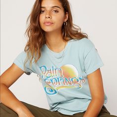 Daydreamer Blue Palm Springs Short Sleeve Cotton T-Shirt Size Small 100% Cotton Brand New With Tags Trendy Light Blue Spring T-shirt, Blue Relaxed Fit T-shirt, Light Blue Letter Print Top For Spring, Light Blue Letter Print Tops For Spring, Light Blue Graphic Tee With Relaxed Fit, Blue Summer T-shirt For Day Out, Blue T-shirt For Summer Day Out, Blue Graphic Print Top For Day Out, Blue Graphic Tee For Loungewear