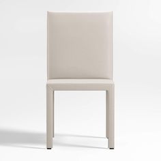 a white leather chair with an open back and square seat, viewed from the side