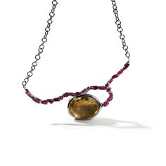 This modern designer necklace is anything but ordinary. It showcases a large, natural oval-cut lemon quartz. In stark contrast to its flawless facets, an unconventional row of uncut rubies is set using German Kabirski's original method. This necklace treads the line between raw and refined with confidence. It's a true one-of-a-kind piece, with no duplicates anywhere in the world. Metal: 925 Silver Stones: Lemon Quartz, Rough Ruby Plating: Black Rhodium Designer Necklace, August Birthstone Jewelry, July Birthstone Jewelry, Fine Art Jewelry, Ruby Necklace, Jewelry Ring Box, Pearl Jewellery Earrings, Men's Jewelry Rings, Lemon Quartz