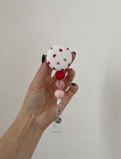 "Valentines badge reel with silicone beads  Required to wear your badge to work? This retractable badge reel would be a unique way to personalize your work attire! Students, teacher, nurses, dentists and all others!  Velcro placed on back to be interchangeable but if you want permanent just let me know!  Just message me if you want a custom request, I look forward to hearing from you! Alligator clip or belt clip options 🌟Retracts 34\"  🌟3/4 diameter velcro button  🌟Silicone beads 🌟interchang Handmade Adjustable White Badge Reel, Adjustable White Badge Holder For Hobby, Nurse Badge Reel, Nurse Badge, Retractable Badge Reel, Belt Clip, Silicone Beads, Badge Holders Lanyard, Work Attire