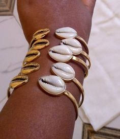 This bracelets and rings are handcrafted with brass. Listing for five bracelets For more bracelets click the link below https://www.etsy.com/listing/929226883/african-handmade-beaded-bangles?ref=shop_home_active_19 Dhl shipping express Thank you. Gold Brass Bracelets For The Beach, Gold Brass Bracelet For The Beach, Metal Bangle Bracelets For Beach, Beach Bangle Bracelets In Metal, Handmade Brass Bracelets For Beach, African Jewellery, Beaded Bangles, Jewelry Template, Dope Jewelry Accessories