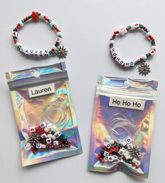 two bags filled with beads and charms on top of a white table next to each other