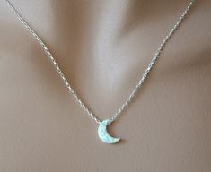 Shop Moon Phase Necklace. You can wear this dainty opal necklace with any style/color of your dress. This layering necklace is made from: - Lab created white opal moon bead- 11 mm x 8 mm - Diamond cut sparkling sterling silver chain - Sterling silver lobster clasp - Sterling silver jump ring Please select a desired length from the drop-down menu. Opal jewelry will make a great gift! Opal is October birthstone. Your order of celestial jewelry will be mailed within 2 business days, nicely packaged Moon Silver Necklace, Opal Necklaces, Dainty Opal Necklace, Opal Moon Necklace, Opal Necklace Silver, Prom Inspo, Moon Phases Necklace, Jewelry Opal, Necklace Opal