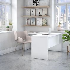 a white desk in an office with two chairs and a laptop on top of it