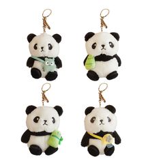 three panda bear key chains hanging from hooks