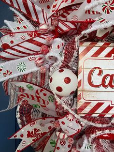 a christmas wreath with candy canes and candies