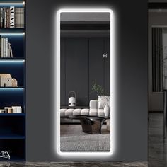 an illuminated mirror in the middle of a living room with bookshelves and furniture