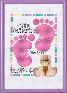 a cross stitch pattern with a teddy bear and baby footprints on it's feet