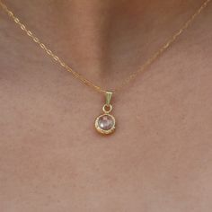 Dainty 14K gold filled CZ solitaire pendant necklace. The Cubic zirconia stone is wrapped in gold filled and hanged on a 14K gold filled necklace. Gemstone is available in a few colors. This delicate women solitaire jewelry fits any outfit or occasion day or night. Classic little bezel necklace that gives an elegant touch to your daily outfit. All components are nickel free. ◆ DETAILS  Chain: 14K gold filled Pendant: CZ stone (cubic zirconia) wrapped in 14K gold filled - 0.31"x0.31" (=8mm X 8mm) Charm Color: Clear (transparent) , Red, Light green, Lavender Length: 16" inch to 20" inch 14 inches (35.5 cm): choker that wrap high around the neck 15 inches (38 cm): closely around the neck 16 inches (40.5 cm): at neckline 17 inches(43 cm): average length 18 inches (45.5 cm): at collar bone 19-2 Gold Dainty Round Crystal Necklace, Dainty Gold Jewelry With Bezel Setting, Gold Round Dainty Crystal Necklace, Dainty Gold-plated Round Birthstone Necklace, Dainty Gold Round Crystal Necklace, Gold Plated Birthstone Necklace With Round Pendant, Gold Dainty Birthstone Necklace With Round Stone, Dainty Gold Birthstone Necklace With Round Stone, Gold Solitaire Necklace With Diamond Cut Round Stone