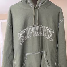 Dark Green Supreme Hoodie Never Worn Band New From The 2020 Summer Collection Winter Streetwear Sweatshirt With Embroidered Logo, Spring Streetwear Hoodie With Embroidered Logo, Urban Long Sleeve Hoodie With Embroidered Logo, Sporty Hoodie With Embroidered Logo For Spring, Winter Athleisure Sweatshirt With Embroidered Logo, Urban Hoodie With Embroidered Logo For Streetwear, Urban Hooded Sweatshirt With Embroidered Logo, Fall Streetwear Hoodie With Embroidered Logo, Oversized Hoodie With Embroidered Logo For Winter