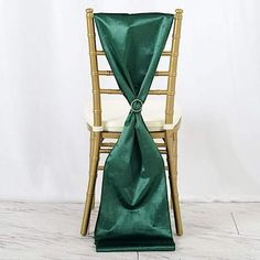 a chair with a green sash draped over it