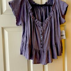 Free People Pretty Short Sleeve Shirt Lavender New With Tags Spring Purple V-neck Shirt, Purple V-neck Summer Shirt, Purple Relaxed Fit Casual Top, Lavender Relaxed Fit Casual Top, Casual Purple Summer Blouse, Purple Cotton Blouse With Relaxed Fit, Casual Purple Blouse For Summer, Purple Short Sleeve Spring Blouse, Spring Purple Blouse With Relaxed Fit