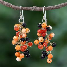 Channel your inner imp with these playful dangle earrings designed by Thailand's Nareerat. Using metallic thread the artisan ties orange agate gemstones into pretty grape-like clusters finishing the earrings with sterling silver hooks. Beaded Agate Dangle Earrings, Artisan Orange Nickel-free Jewelry, Orange Natural Stones Drop Earrings, Orange Natural Stone Drop Earrings, Handmade Orange Agate Jewelry, Unique Orange Agate Jewelry, Unique Orange Earrings With Dangling Beads, Orange Carnelian Dangle Earrings, Unique Agate Dangle Earrings