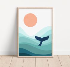 a framed poster with a whale in the ocean