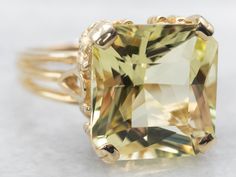 Gorgeous and eye-catching, this yellow gold square cut lemon quartz solitaire ring adds a pop of bling to any outfit without overwhelming it. The unique shape is sure to draw envious glances - and if you're lemony for a statement piece, you'll love this citrusy treat!Metal: 14K Yellow GoldGem: Lemon Quartz 8.30 CaratsGem Measurements: 12.5 x 13.2 mm, SquareRing Size: 8.75Marks: "14K (P) S" Stamped on the inside band Yellow Cushion Cut Gemstone Ring, Luxury Yellow Square Cut Rings, Yellow Citrine Topaz Ring Rectangular Shape, Yellow Citrine Cushion Cut Ring, Yellow Rectangular Gemstone Rings, Elegant Yellow Square Cut Rings, Elegant Yellow Rectangular Rings, Classic Yellow Rectangular Rings, Luxury Yellow Rectangular Rings