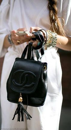 Chanel - this one's a little better looking - or at least different from all the other Chanel bags. - I don't know - I don't get why they are so expensive - most don't have any compartments in them - are very dressy - this one's not bad looking though. Why do you want the huge CC on the front of your bag? - the small gold cc is okay. Mochila Chanel, Winter Purses, Chanel Backpack, Mini Mochila, Street Style Shoes, Nike Nfl, Lv Bags, Handbag Heaven, Style Winter