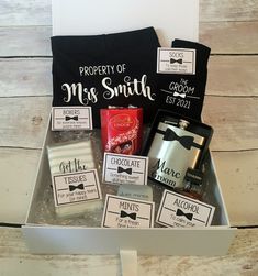 the grooms gift box is filled with personalized items for him and his bride