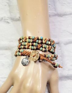 This beautiful beaded leather double wrap bracelet features seed beads in a picasso finish. They were hand woven onto high quality, premium leather. It was finished with a wood button with flowers burned on the button. It measures 22 inches to the loop.  What a great bracelet to wear with your favorite t-shirt, jeans and boots! Please measure your wrist carefully. This wrap bracelet is meant to wrap around your wrist three times.  Please Note - Due to the differences in computer monitors and cel Brown Beaded Wrap Bracelet For Beach, Beaded Brown Wrap Bracelet For The Beach, Beaded Brown Wrap Bracelet For Beach, Bohemian Adjustable Wrap Bracelet With Round Beads, Hippie Wrap Bracelet With Round Beads, Bohemian Adjustable Hand Wrapped Leather Bracelet, Adjustable Bohemian Wrap Bracelet With Round Beads, Hippie Style Adjustable Wrap Bracelet With Round Beads, Hippie Adjustable Wrap Bracelet With Round Beads