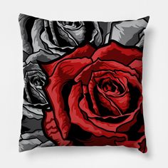 a black and red rose pillow on a white background with the image of two roses