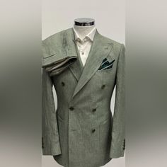 Green 100% Loro Piana Fabric In Double Breasted Linen Suit Made In Italy. Patch Pocket 5 Inch Peak Lapel Double Stitched Double Vent On Suit Side Buckle On Flat Front Pant This Is Not A Tom Ford, Ralph Lauren, Enzo, Canali, Brunello Cucinelli, Gucci, Suitsupply, Kiton, Zegna, Brioni, Hugo Boss, Giorgio Armani, Dolce&Gabbana, Indochino, Ted Baker, Paul Paul Smith, Prada. But I Will Put This Suit Next To Any One Of Those Suits And It Will Come Out On Top Because Of The Value, Cut, Style And Fit. I Elegant Green Linen Suits, Elegant Double Breasted Linen Suit For Formal Occasions, Elegant Linen Double Breasted Suit For Formal Occasions, Elegant Linen Double Breasted Suit For Tailoring, Elegant Linen Double Breasted Suit, Elegant Fitted Linen Double Breasted Suit, Formal Double Breasted Fitted Linen Suit, Formal Fitted Linen Double Breasted Suit, Luxury Linen Suits For Spring