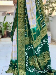 New Super Hit Bandhani Saree With Premium Products  HEAVY CHEX GHARCHOLA 🔥Fabric:- Art Silk With Zari Waving 🔥Awesome Heavy Zari Waving  Saree 🔥Work :~ Hend Bandhej 🔥100% Orignal Bandhej Saree Bandhani, one of the oldest known methods of tie-dyeing, is still widely practiced in western India today. The fabric is made by pinching very small portions of cloth and tying them by plucking the cloth with the fingernails into many tiny bindings that form a figurative design to form an intricate pat Bollywood Style Traditional Wear With Batik Print For Navratri, Bollywood Style Batik Print Traditional Wear For Navratri, White Traditional Wear With Bandhani Print, White Bandhani Traditional Wear For Festivals, White Bandhani Print Traditional Wear For Festivals, White Bandhani Print Traditional Wear For Navratri, White Bandhani Traditional Wear For Navratri, Bohemian Green Batik Print Saree, Unstitched White Saree With Bandhani Print