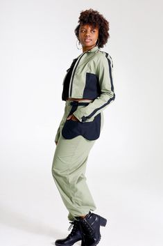 "Let them catch your vibe wearing this edgy pant set with matching jacket. This combo is crafted with cotton, mixed with denim, and designed with three pockets on the jacket, and three pockets on the pants, Cargo style! The jackets design is color blocked for that edginess it brings and the pants has a unique outer pocket on the left front and a half belt closure. Pair up this outfit with a cute bandeau top, or bodysuit and combat boots, Make all your friends wish they had this set too. All of o Cotton Track Jacket With Pockets For Work, Fitted Cotton Parachute Pants For Fall, Sporty Cotton Track Jacket For Work, Fitted Cotton Track Jacket With Pockets, Cargo Jacket Women, Bridal Face Mask, Womens Utility Jacket, White Face Mask, Women Cargo Pants