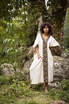 Introducing our KAFATU stunning handmade African patterned Kaftan, the perfect choice for any ceremonial or ritual occasion. This beautiful piece features vibrant, bold colours and intricate African-inspired tribal patterns naturally dyed with leaf and bark. In addition to its striking design, this kaftan is also functional and practical. The kaftan features two pockets, which provide convenient storage space for your essentials so that you can move around with ease. Made of lightweight, breatha Bohemian Maxi Dress For Ceremonial Occasions, Traditional Pattern Maxi Kaftan For Ceremonies, Traditional Pattern Dresses For Rituals And Festivals, Traditional Festival Dresses For Rituals, Traditional Dresses For Rituals And Festivals, Bohemian Maxi Dress For Festivals And Traditional Ceremonies, Bohemian Handloom Dress For Festivals, Bohemian Maxi Dress With Traditional Patterns For Ceremonies, Bohemian Ceremonial Dresses With Woven Motifs