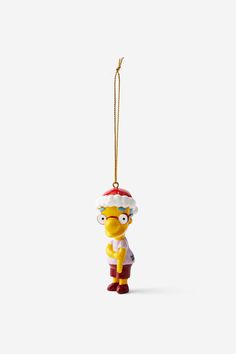 the simpsons christmas ornament hanging on a string