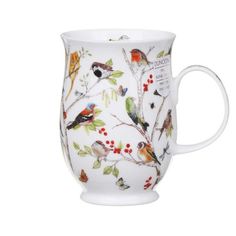 a white coffee cup with birds on it