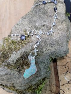 Ethiopian opal, Herkimer diamond & iolite choker. Perfect for summer as this stone looks like it has glitter inside. The glitter effect is visible in sunlight and especially indirect/indoor light. The opal also happens to be shaped like Florida 🙂 The choker is 14.5 inches with a 3 inch drop. It clasps in the front where there is a small iolite accent. The opal is hanging below a chain of Herkimer diamonds that extends up the chain and transitions to iolite. Opals are very difficult to photo Lotus Necklace, Rainbow Opal, Diamond Choker, Moonstone Bracelet, Opal Bracelet, October Birthstone, Herkimer Diamond, May 11, October Birth Stone