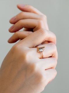 Why You'll Love It This alternative and geometric inspired ring displays a polished kite salt and pepper diamond that has a perfect mixture of unique inclusions. The center stone is encased in a one-of-a-kind setting with a minimal band and bright petite diamonds to emphasis its beauty. Details 14K solid gold Band width is approx. 1.60mm Salt & pepper kite diamond x 1 piece (0.7~0.9ct) Size of gem may vary based on our selection for all non-custom engagement rings. SI/G 1mm Diamond x 10 pieces ( Kite Diamond, Geometric Inspiration, Hexagon Design, Solid Gold Band, Pepper Diamond, Ring Displays, Beauty Design, Star Ring, Salt And Pepper Diamond