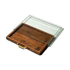 an old wooden box with glass top