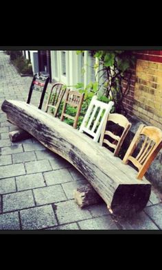 some chairs are sitting on a wooden bench