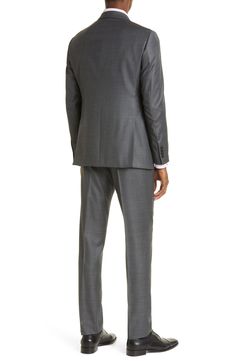 Textured virgin-wool sharkskin construction defines a modern, stylish suit framed by bold notched lapels. Jacket has notched lapels; four-button cuffs; chest welt pocket; front flap pockets; side vents Trousers have zip fly with hook-and-bar closure; front slant pockets; back button-welt pockets Jacket is lined; trousers are lined to the knee 100% wool Dry clean Imported Business Suits With Notch Lapel And Concealed Placket, Notch Lapel Suits With Concealed Placket For Business Meetings, Tailored Three-piece Suit With Pressed Crease For Business Meetings, Tailored Three-piece Suit For Business Meetings, Tailored Suit With Pressed Crease For Business Meetings, Tailored Suits With Pressed Crease For Business Meetings, Modern Office Suits With Notch Lapel, Modern Flat Front Suits With Hidden Button Closure, Three-piece Suit With Pressed Crease For Office