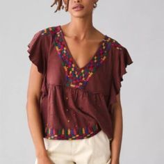 Anthropologie Embroidered Ruffle-Sleeve Peplum Blouse Top Brown Large Petite V-neck Top With Geometric Embroidery For Fall, Chic Multicolor Tops With Floral Embroidery, Chic Multicolor Top With Floral Embroidery, Chic Multicolor Floral Embroidered Tops, Bohemian Cotton Tops With Ruffle Sleeves, Bohemian Cotton Top With Ruffle Sleeves, Embroidered Ruffle Sleeve Summer Tops, Embroidered Ruffle Sleeve Tops For Summer, Summer Embroidered Blouse With Flutter Sleeves