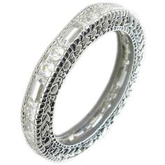 Zirconite Cubic Zirconia Sterling Silver all around Filigree Designer style Eternity band Ring 501R23516 Meticulously crafted in Sterling Silver as fine jewelry and Electroplated w/Rhodium for that Look-of Real finish. Zirconite stones alternate Rounds & Baguettes. Also available in alternating colors of: Ruby/Clear, Emerald/Clear, Sapphire/Clear, Pink/Clear, Lavender/Clear. Cubic Zirconia Rings Eternity Bands, Luxury Cubic Zirconia Engagement Bands, Luxury Wedding Engraved Ring With Cubic Zirconia, Luxury Cubic Zirconia Band, Luxury Cubic Zirconia Bands With Prong Setting, Luxury Delicate Cubic Zirconia Rings, Luxury Halo Cubic Zirconia Eternity Band, Luxury Marquise Cut Cubic Zirconia Eternity Band, Luxury Everyday Cubic Zirconia Rings