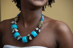 Unique Africa Maasai Handcrafted Leather Beaded Necklace with an Elegant Look and Brilliant Finish. Color = Blue, White, and Brown, with details of brass. Length (Around Neck) =20 Inches. **GET FREE SHIPPING FOR ADDITIONAL ITEMS PURCHASED. Yes, Buy Multiple Items and pay shipping for 1 item only- The rest ships Free. (No Limits on the number of Multiple items). With a faster delivery time of 3 days via DHLExpress, Worldwide. Ordinary/Standard Shipping also available upon request. We Custom Make Blue Jewelry With Wooden Beads, Blue Necklaces With Wooden Beads, Blue Spiritual Necklace With Wooden Beads, Spiritual Blue Necklace With Wooden Beads, Unique Blue Jewelry With Wooden Beads, Traditional Turquoise Necklace With Wooden Beads, Blue Wooden Beads Necklace As Gift, Blue Wooden Beads Necklace For Gift, Blue Necklaces With Wooden Beads For Gift