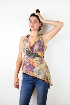 Floral asymmetrical blouse In great condition Tag: Labod Material: 68% cotton, 32% silk Size: Eu 42, medium, large bust 41 cm = 16 in length 56 cm = 22 in waist 40 cm =15,5 in Thank you for your visit! View more products: https://www.etsy.com/shop/VintageSeventhHeaven Feel free to contact me if you have any questions. Sleeveless Purple Cotton Blouse, Purple Cotton Sleeveless Blouse, Fitted Multicolor Asymmetrical Top, Bohemian Summer Tops With Asymmetrical Hem, Bohemian Tops With Asymmetrical Hem For Summer, Bohemian Blouse With Asymmetrical Hem For Summer, Purple Sleeveless Bohemian Tops, Multicolor Asymmetrical Hem Tops For Summer, Purple Sleeveless Blouse For Beach