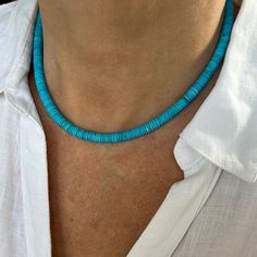 "This gorgeous electric blue turquoise necklace is handcrafted with highly coveted 6mm blue Persian turquoise heishi beads from the northeastern mountainous region of Persia. The modern wafer disc cut of the 6mm beads is sleek, uniform and symmetrical. This is a great necklace to wear as a single strand of paired with your other favorite necklaces for a stunning layered look.  The beads are symmetrical and uniform in color and saturation with minimal matrix as fine Persian turquoise is known for Blue Turquoise Necklace With Spacer Beads As Gift, Artisan Blue Heishi Beads Necklaces, Blue Single Strand Heishi Bead Necklaces, Blue Single Strand Heishi Beads Necklace, Blue Single Strand Heishi Beaded Necklaces, Blue Single Strand Heishi Beaded Necklace, Blue Heishi Beads Necklace With Polished Beads, Blue Turquoise Beaded Heishi Necklace, Handmade Blue Turquoise Rondelle Necklace