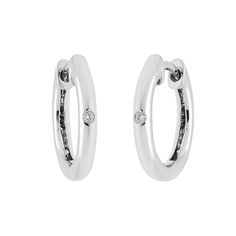 The combination of modern and classic never gets old. These hinged hoop earrings combine the best of both worlds into one wearable accessory. Bring home simple style today for a look you'll love to show off for years to come! -Earrings are crafted of luxurious sterling silver -Earrings feature one sparkling bezel set diamond each, weighing .02ct tw -Diamonds are ethically and responsibly sourced -Enjoy free cleaning and inspection at any Day's location for life of these sterling silver hoop earr Home Simple, Mother Rings, Bezel Set Diamond, Silver Jewelry Fashion, Sterling Silver Hoop Earrings, Engraved Items, Sterling Silver Hoops, Silver Hoops, Diamond Stone