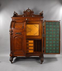 an old wooden cabinet with many drawers