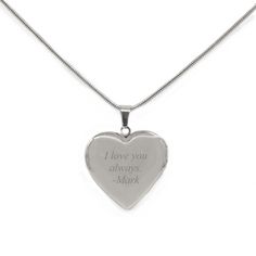 "PERSONALIZE THIS GIFT WITH A NAME OR SMALL MESSAGE ON THE BACK This heart locket necklace can be engraved with a single initial on the backside of the pendant. Making this locket a treasured gift. The locket on the silver heart necklace can fit two photos or personalized notes on the inside. The silver locket necklace has a heart-shaped pendant that measures 1.125\" x \"1.125\". The face of the silver heart necklace is engraved with an ornate design surrounding a small heart. The pendant neckla Personalized Locket Necklace For Valentine's Day Keepsake, Customizable Heart Locket Necklace For Valentine's Day, Personalized Locket Necklace For Valentine's Day Anniversary, Customizable Locket Necklace For Valentine's Day, Valentine's Day Engraved Locket Necklace For Anniversary, Valentine's Day Customizable Locket Necklace, Silver Heart Locket, Silver Locket Necklace, 50th Anniversary Gifts