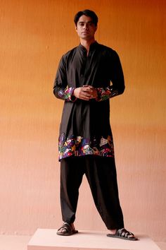 Black silk kurta with figurine motifs, highlighted with bead embroidery on the hem and sleeves. Paired with a pant. - Aza Fashions Black Silk Kurta, Kurta Men, Kurta Pant Set, Silk Kurta, Kurta With Pants, Fashion App, Band Collar, Bead Embroidery, Pant Set